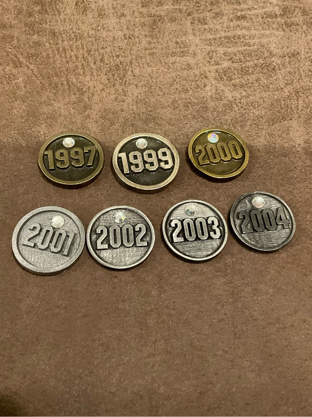Set of 7 Year Tokens from a Plaque